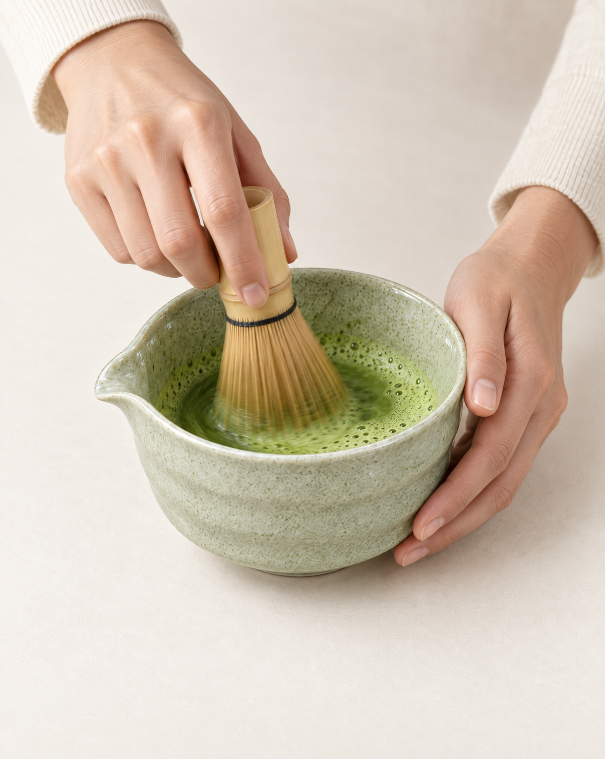 Whisking matcha in the Tokyo Whisk Speckled Sage bowl